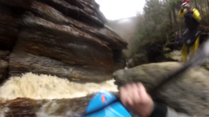 Dropping into the gutter on the final rapid.